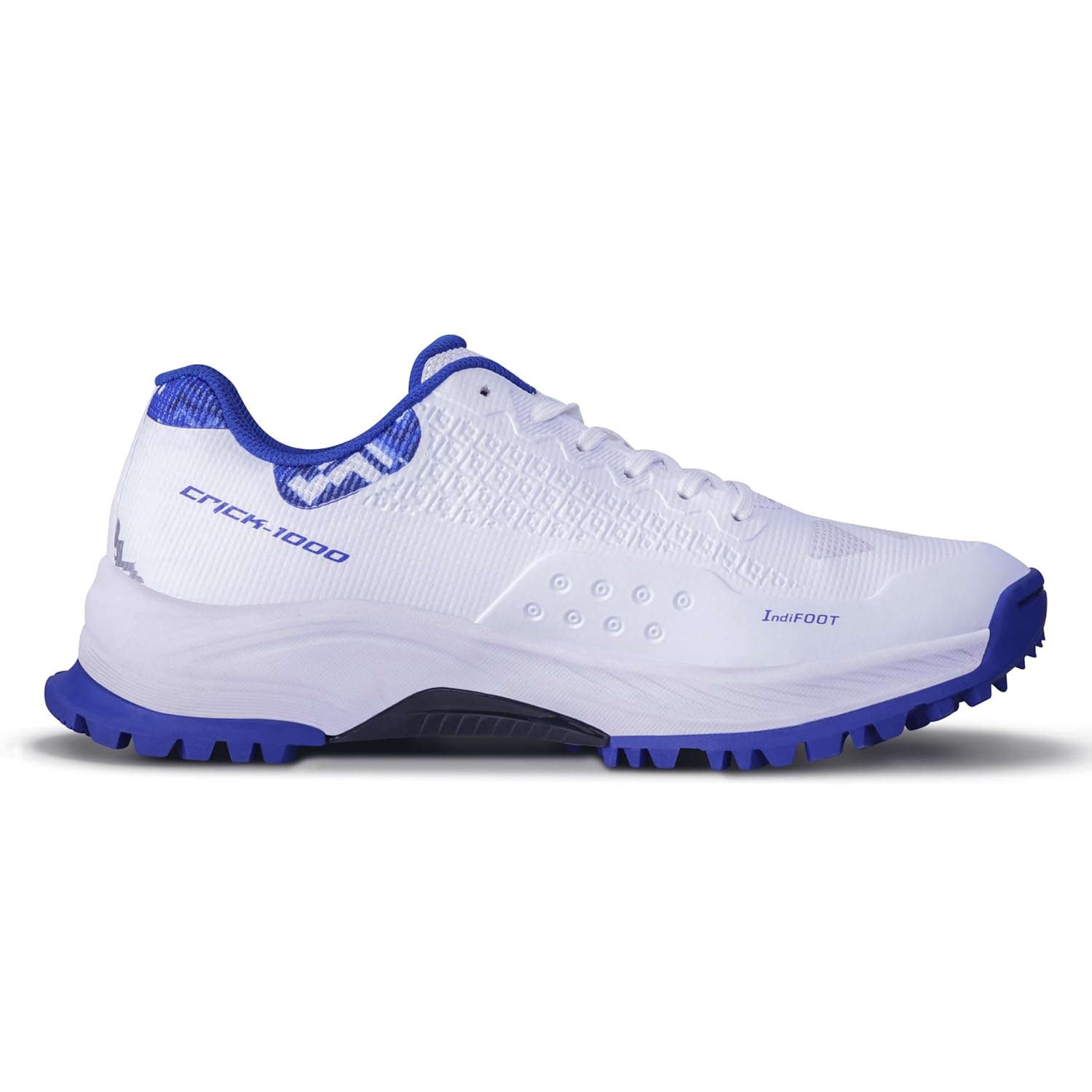 Side view of NIVIA Crick 1000 Cricket Shoes in white and blue featuring a breathable mesh upper with TPU Fusion Technology, cushioned midsole, reinforced toe area, and rubber outsole designed for grip and support during cricket matches and training.