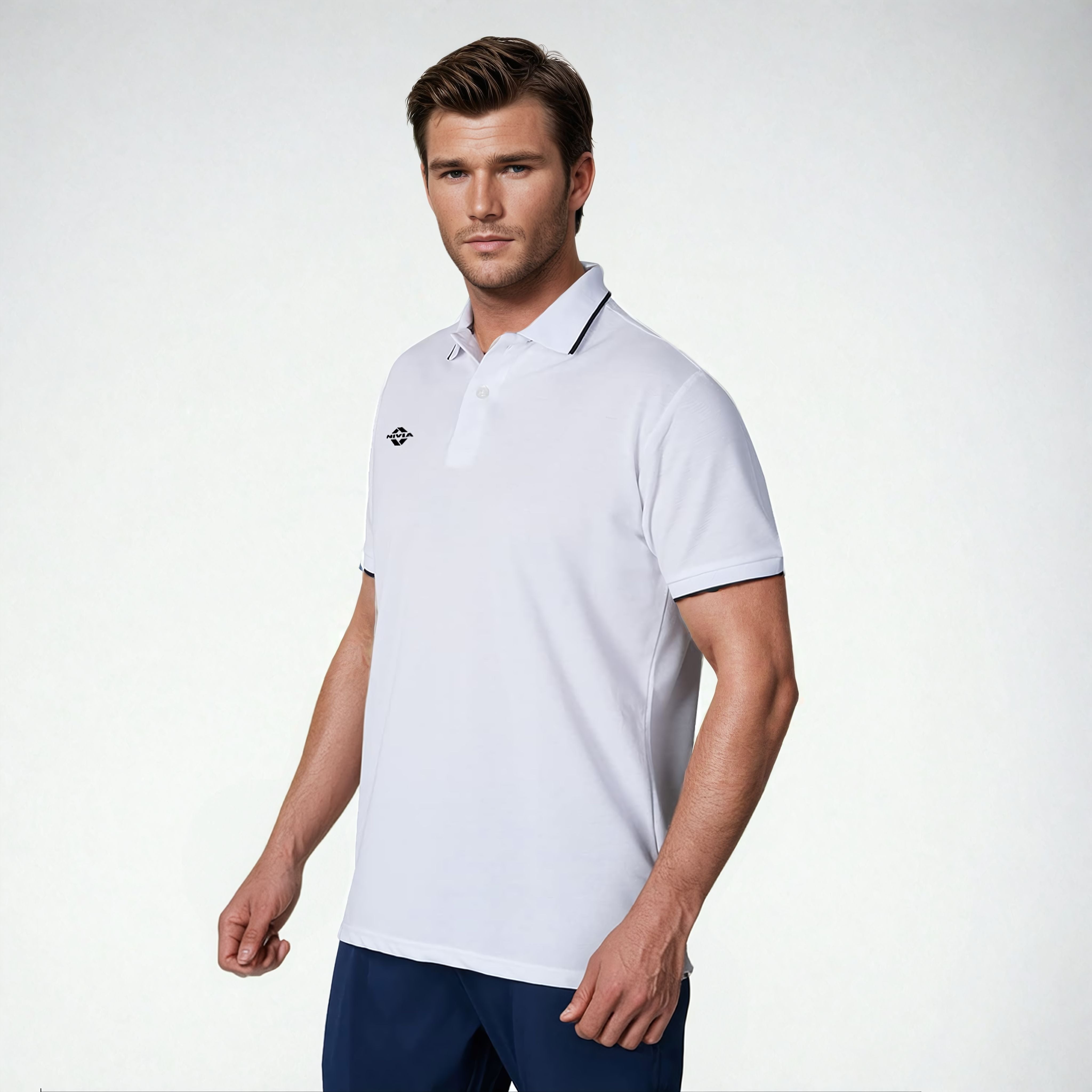 Angled front view of a model wearing the NIVIA Ray 17 Polo Shirt in light grey, featuring a classic collar with button placket and contrast trim on the collar and sleeve cuffs, made from polyester cotton fabric for everyday casual wear.