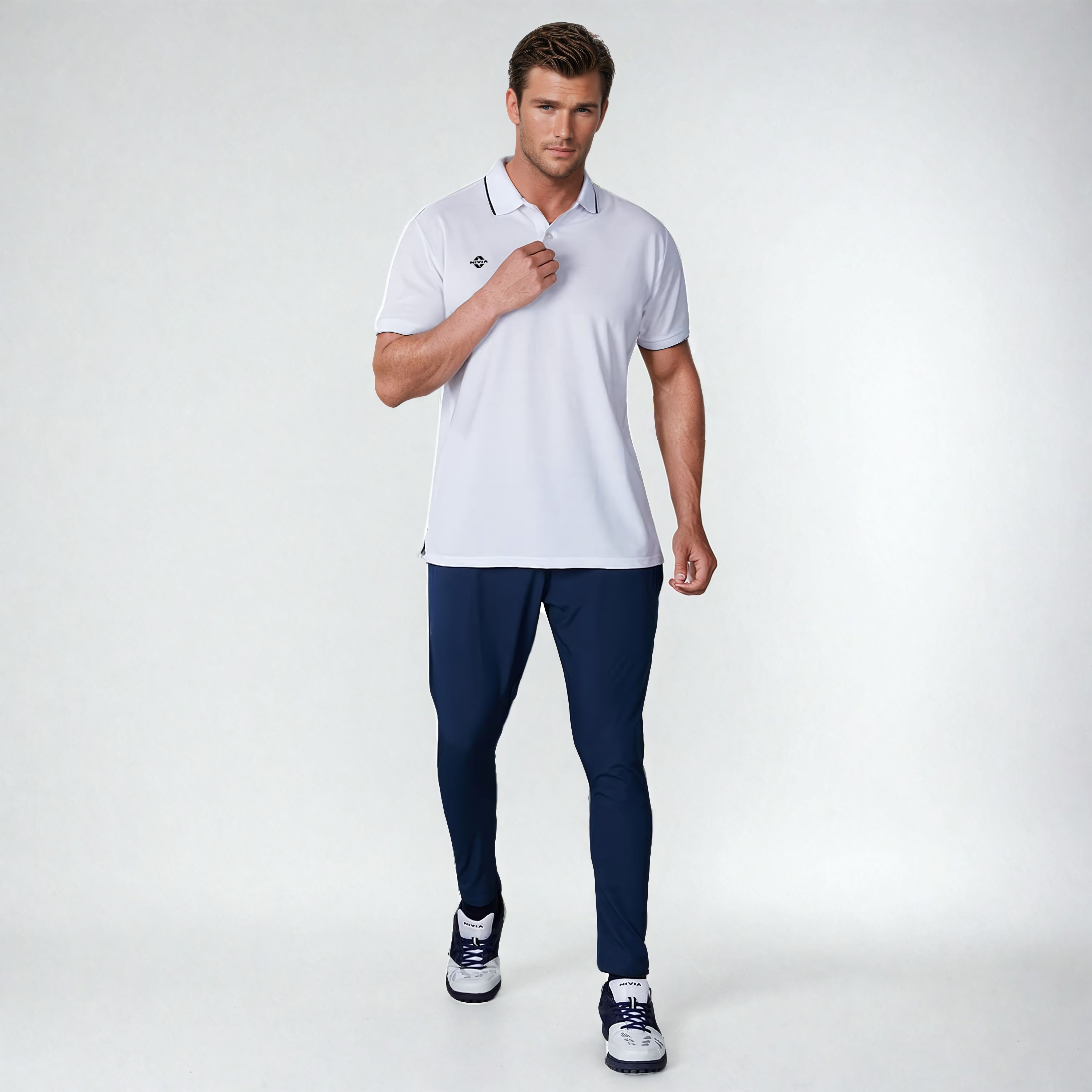 Full-length front view of a model wearing the NIVIA Ray 17 Polo Shirt in light grey with a classic collar and contrast trim on the collar and sleeve cuffs, made from polyester cotton fabric for everyday casual wear.