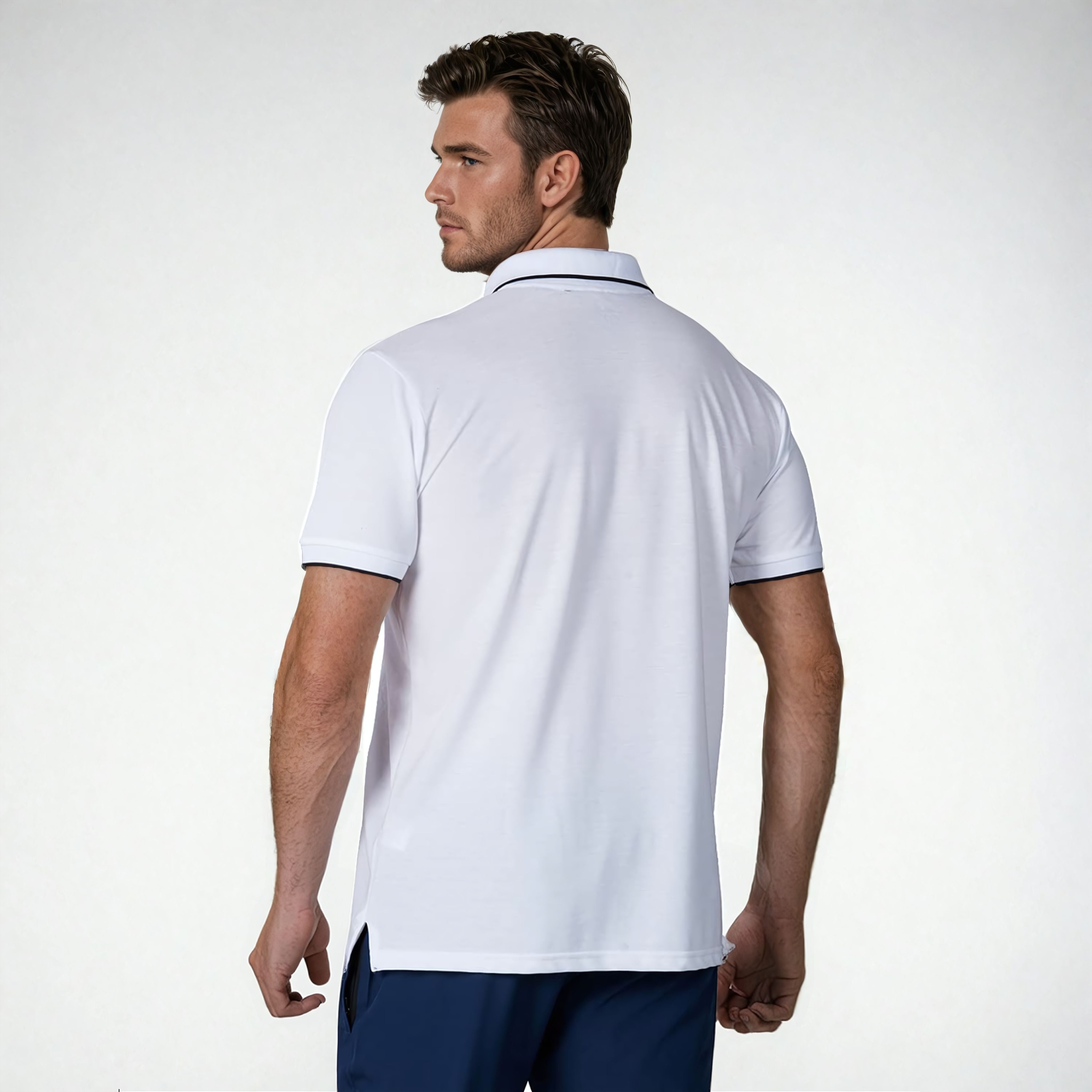 Back view of a model wearing the NIVIA Ray 17 Polo Shirt in light grey, featuring a classic collar with contrast trim and short sleeves, made from polyester cotton fabric for everyday casual wear.