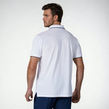 Back view of a model wearing the NIVIA Ray 17 Polo Shirt in light grey, featuring a classic collar with contrast trim and short sleeves, made from polyester cotton fabric for everyday casual wear.