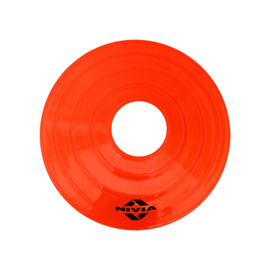 Orange NIVIA saucer cone with low-profile circular design and center opening, used for marking boundaries, drill stations, and agility layouts during indoor and outdoor sports training sessions.