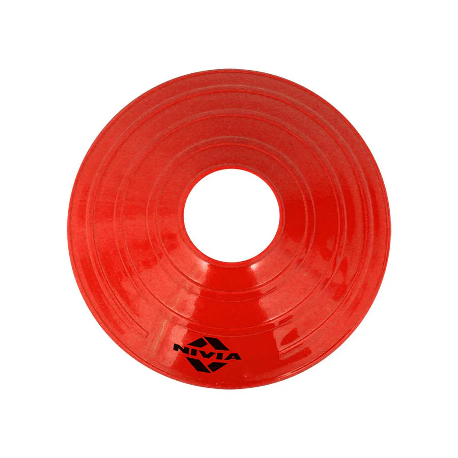 Red NIVIA saucer cone with circular low-profile design and center opening, suitable for marking boundaries and drill stations during agility, fitness, and sports training sessions for indoor and outdoor use.