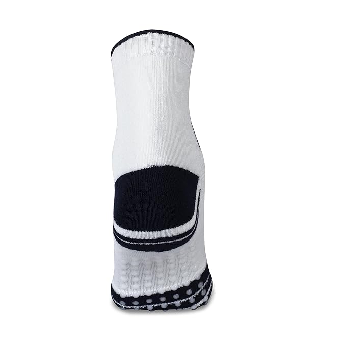 Rear view of a white NIVIA Court Sock with navy heel panel and trim, featuring anti-slip silicone grip dots on the sole and a high ankle design for added support and stability during sports activities.