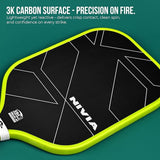 Close-up of the NIVIA K-3000 Pro Pickleball Paddle highlighting its 3K carbon surface with geometric line detailing and neon yellow edge guard. Overlay text reads: “3K CARBON SURFACE – PRECISION ON FIRE. Lightweight yet reactive – delivers crisp contact, clean spin, and confidence on every strike.