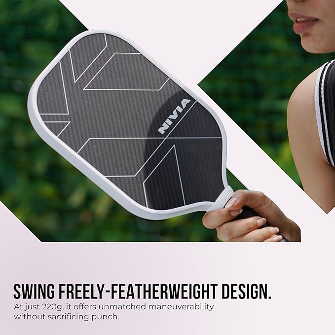 Nivia K-2500 Pickleball Paddle held in hand, black carbon surface with white geometric design and white edge guard, lightweight 220 g construction for maneuverable outdoor play.