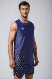 Model wearing the NIVIA Skylite Track and Field Athletic Kit in blue, featuring a sleeveless jersey and matching shorts with yellow accent detailing, suitable for track and field training and sports activities.