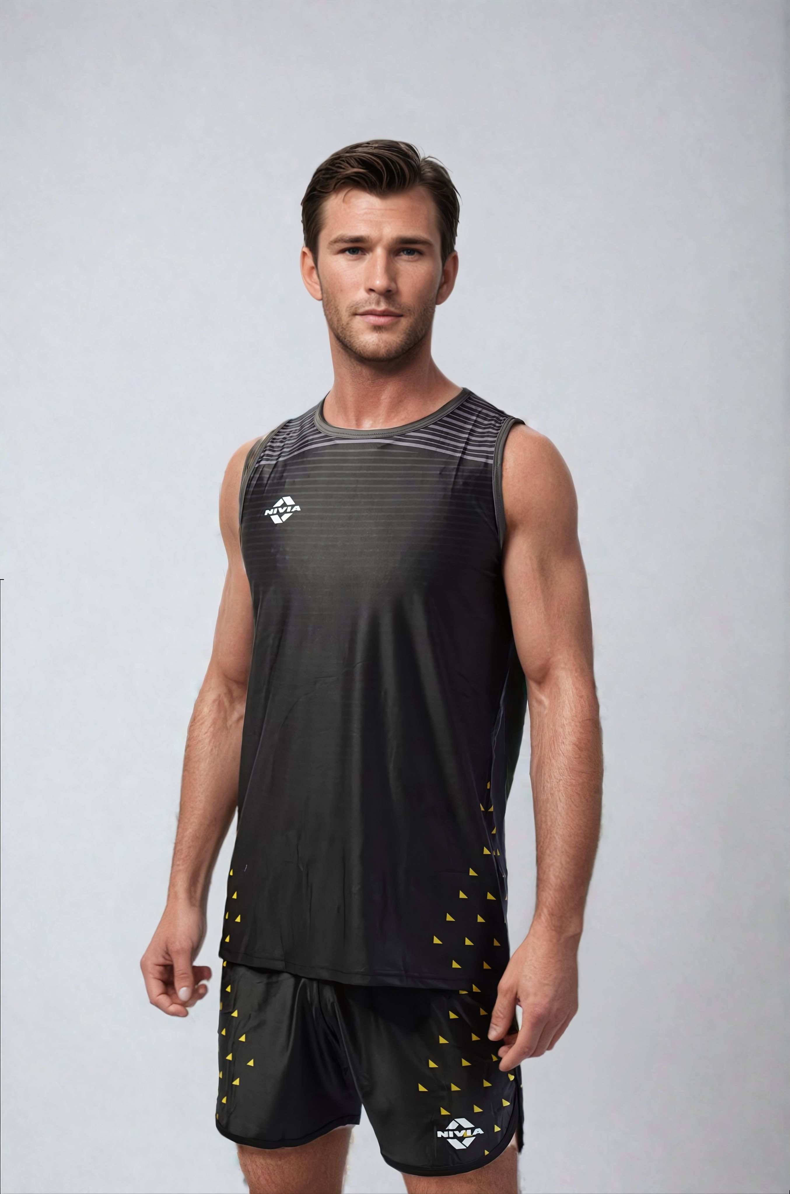 Model wearing the NIVIA Skylite Track and Field Athletic Kit in black, featuring a sleeveless athletic jersey and matching shorts, suitable for training sessions and track and field activities.