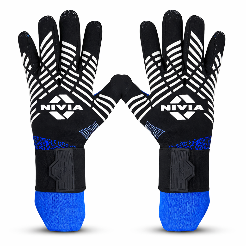 Pair of NIVIA Shastra Goalkeeper Gloves in black with white grip detailing and blue wrist accents, featuring a latex palm and adjustable wrist strap, designed for grip, hand support, and controlled movement during football training and match play.